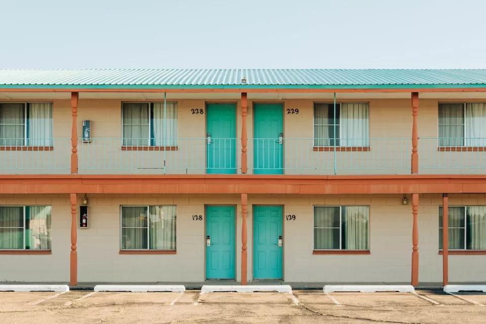 Roadside motel with turquoise room doors in Tucumcari, New Mexico.